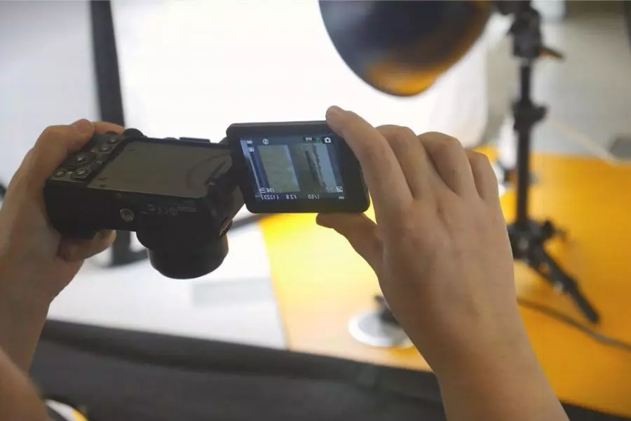 Woman uses a digital camera